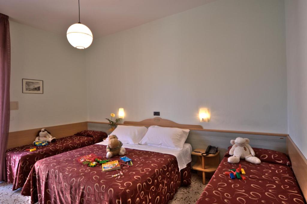 Postel nebo postele na pokoji v ubytování Hotel Hamilton