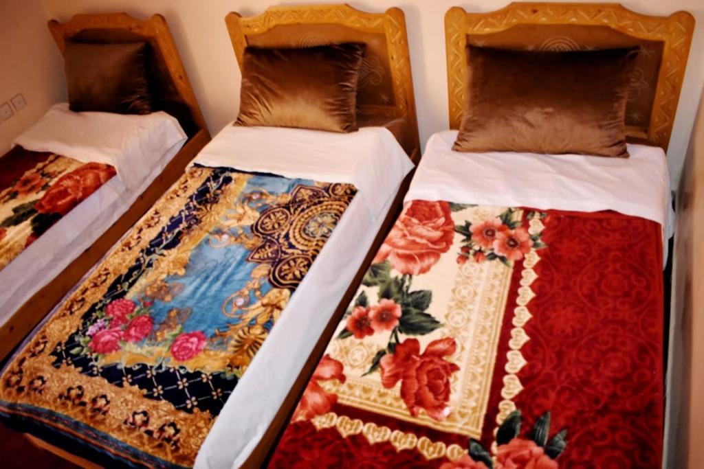 Postel nebo postele na pokoji v ubytování Dar Akiode Toubkal