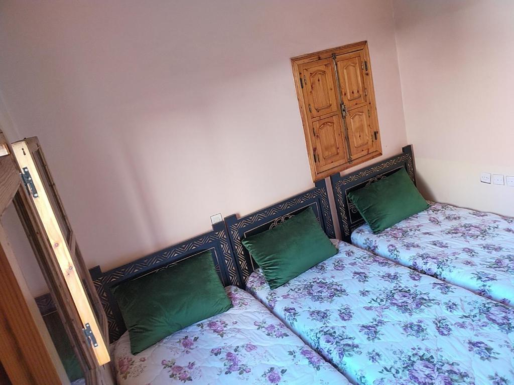 Postel nebo postele na pokoji v ubytování Dar Akiode Toubkal
