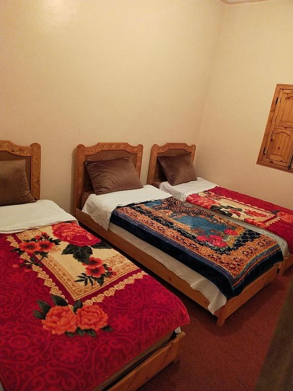 Postel nebo postele na pokoji v ubytování Dar Akiode Toubkal