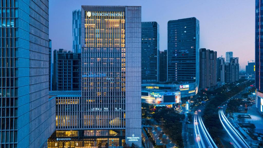 a view of a city at night with buildings at InterContinental Foshan DongPing in Shunde