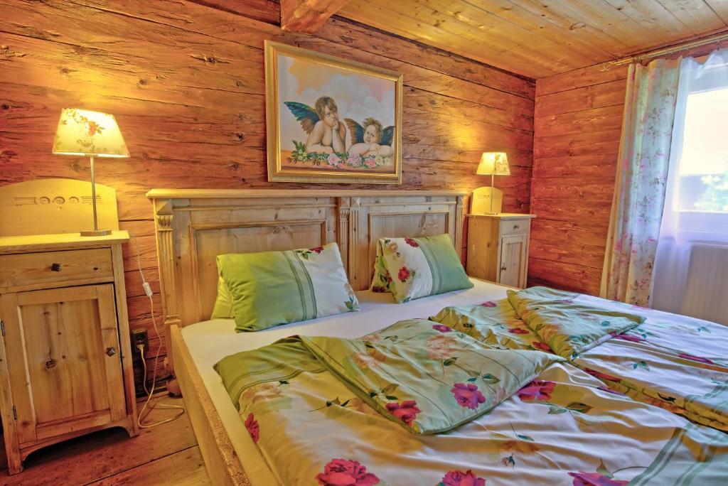 Postel nebo postele na pokoji v ubytování Chalet Rastenhof - Urlaub auf dem Bauernhof in Österreich