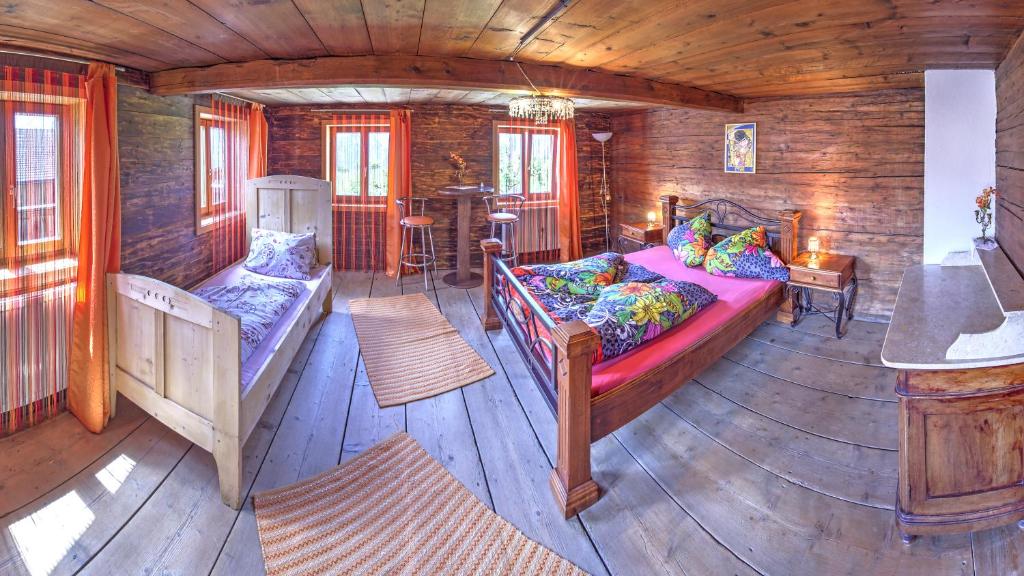 Postel nebo postele na pokoji v ubytování Chalet Rastenhof - Urlaub auf dem Bauernhof in Österreich