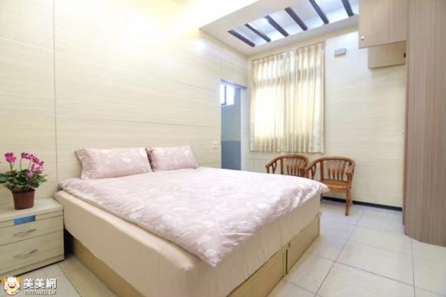 Postel nebo postele na pokoji v ubytování Lvyou B&B