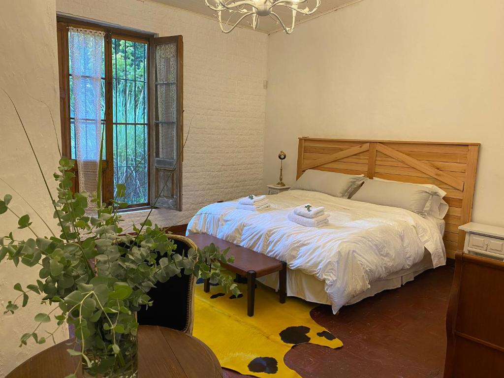 En eller flere senge i et værelse på Don Aniceto - Suites de Campo