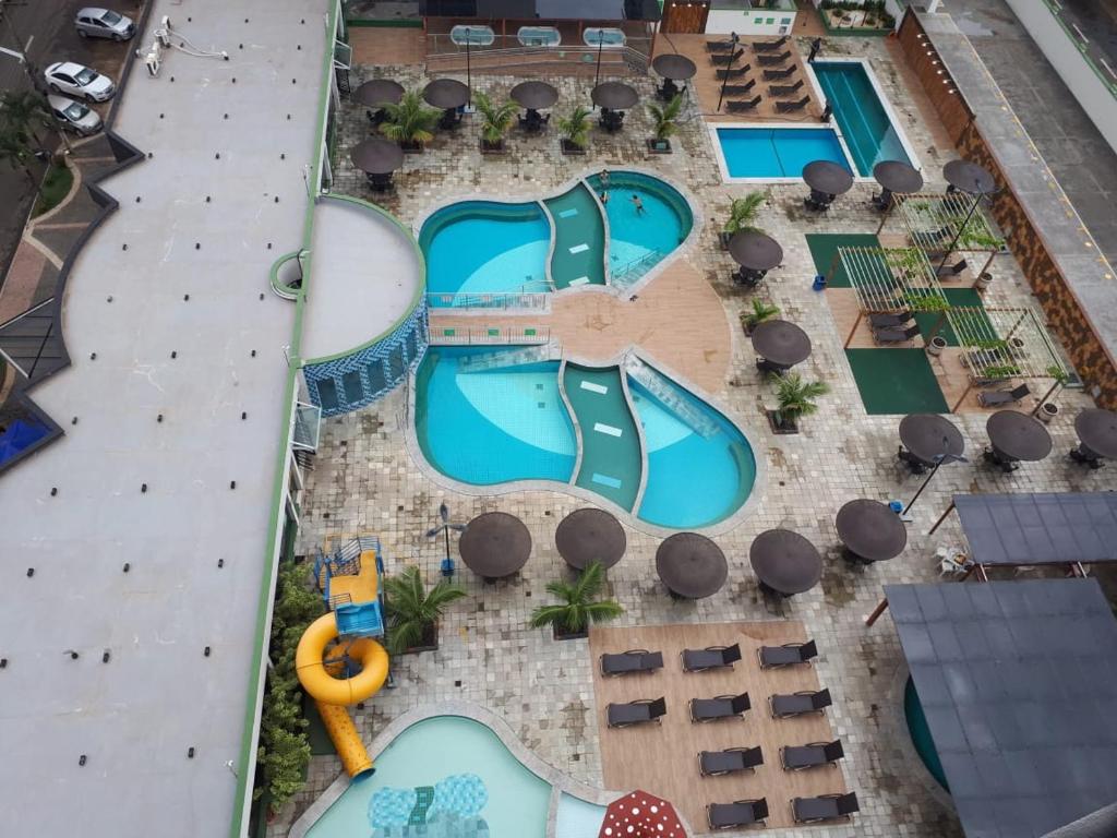 an aerial view of a pool at a resort at CALDAS NOVAS Aconchego e Diversão in Caldas Novas