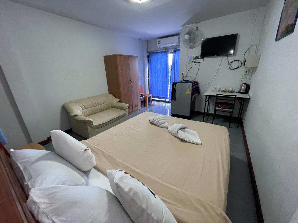 Postel nebo postele na pokoji v ubytování Jenny Hostel HuaHin
