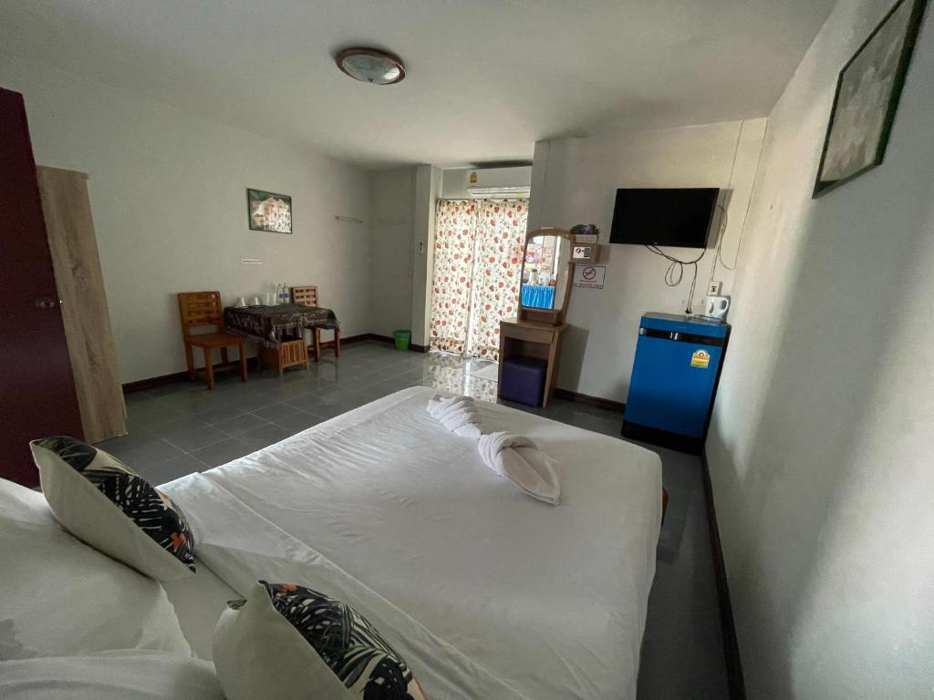 Postel nebo postele na pokoji v ubytování Jenny Hostel HuaHin