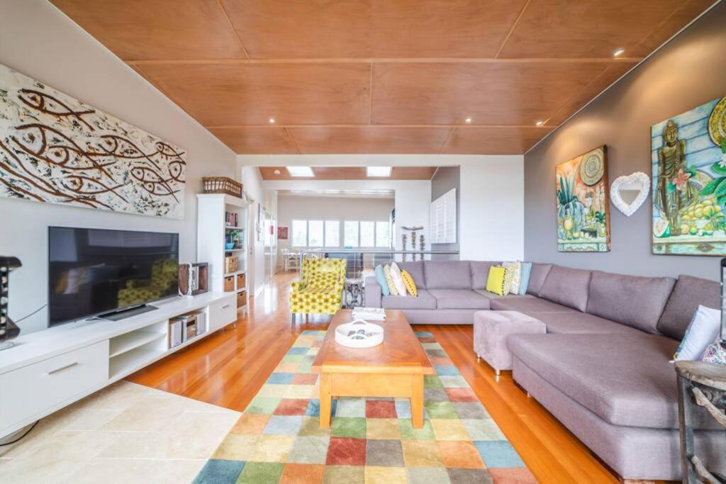 a living room with a couch and a table at Saltwater 5 - sleeps 8 - pet friendly in Point Lookout