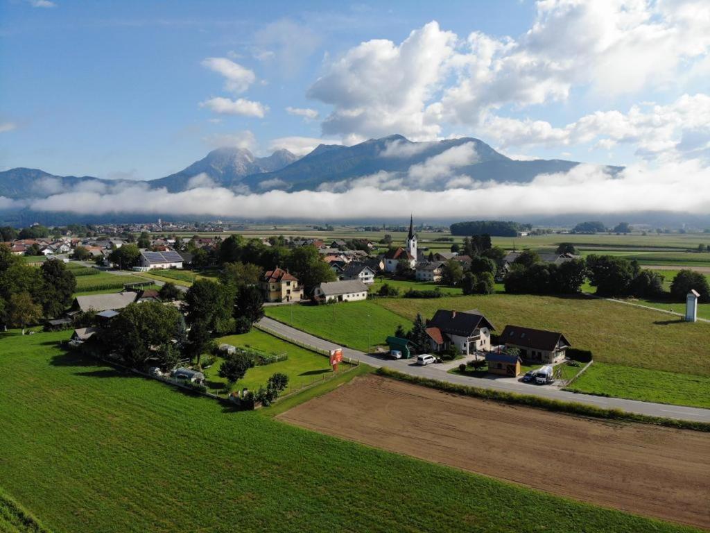 an aerial view of a small town with mountains in the background at Avio rooms in Cerklje na Gorenjskem