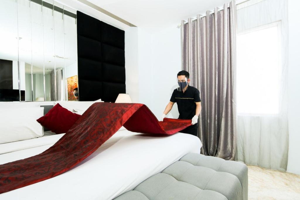 Postel nebo postele na pokoji v ubytování Gino Feruci Braga by KAGUM Hotels
