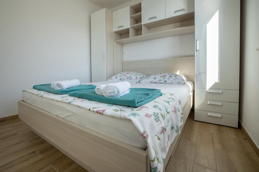 Postel nebo postele na pokoji v ubytování Apartman Nimfa Živogošće