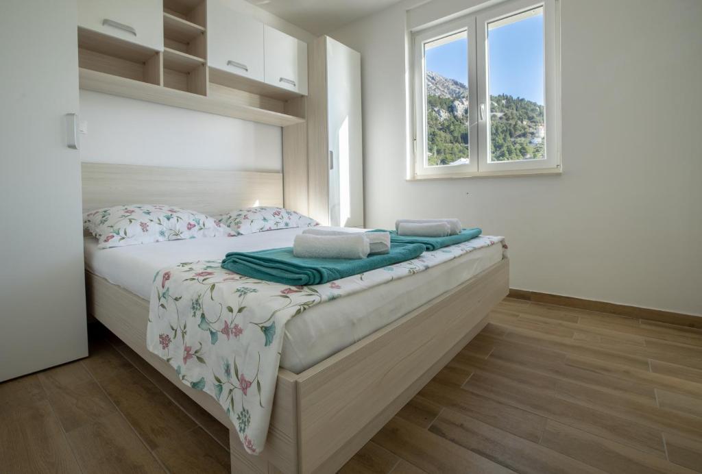 Postel nebo postele na pokoji v ubytování Apartman Nimfa Živogošće