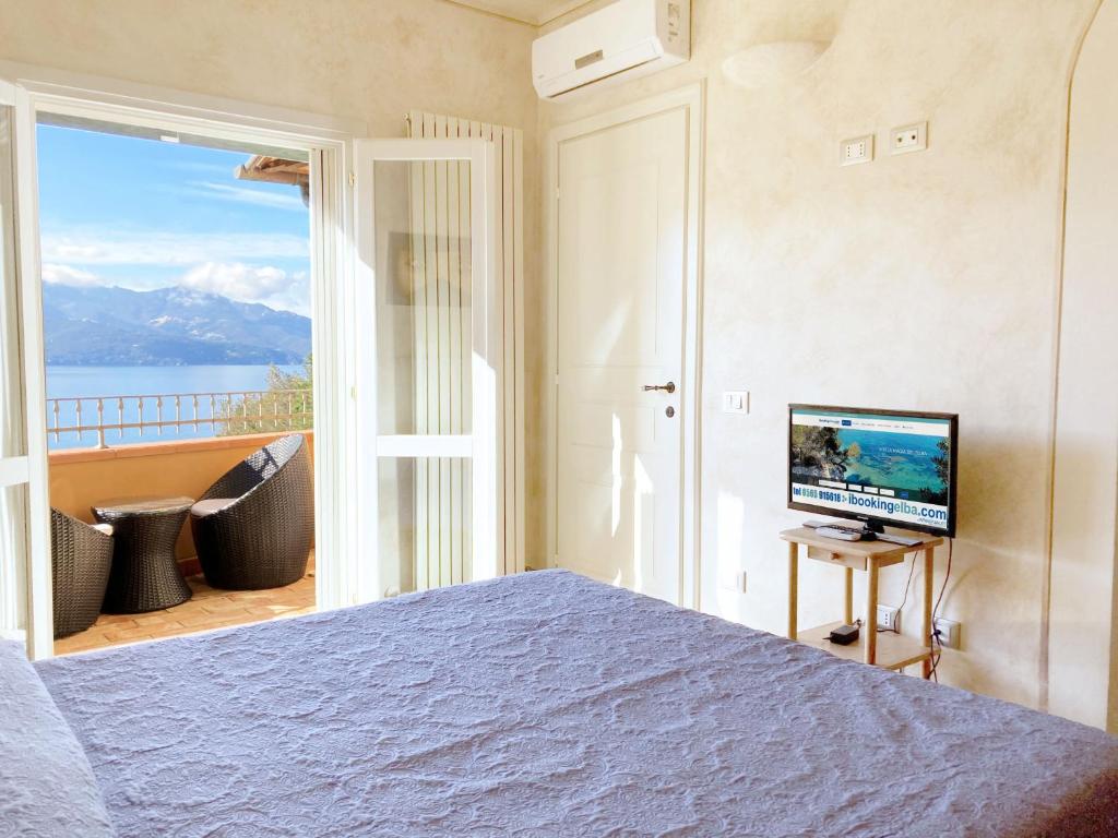 TV a/nebo společenská místnost v ubytování Villetta Paradiso by ArgonautiVacanze