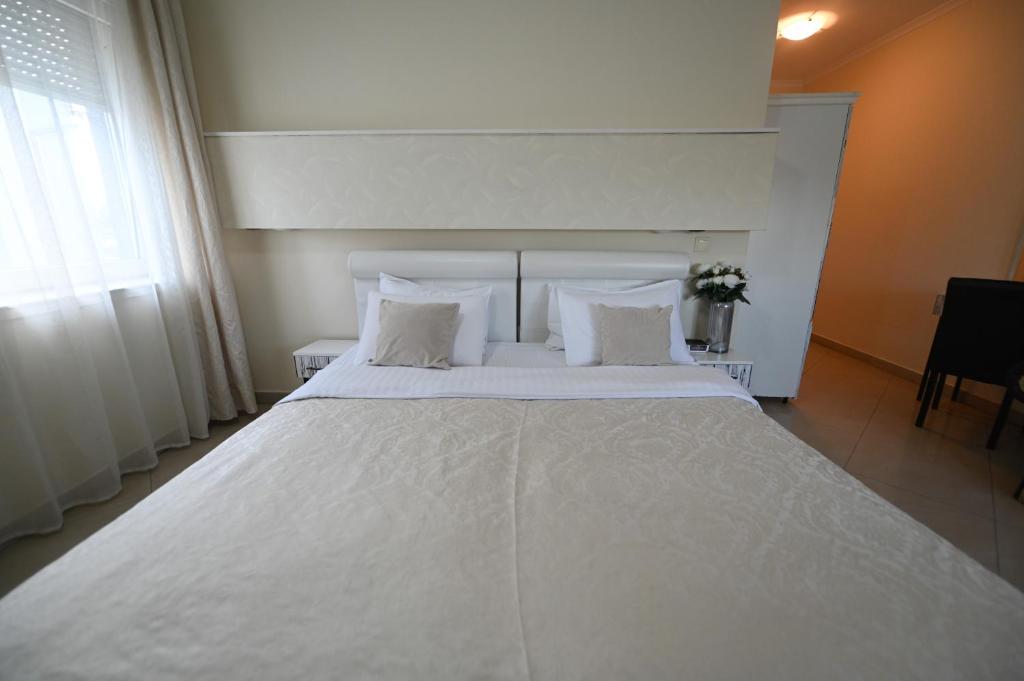 Letto o letti in una camera di Garni Hotel Dash