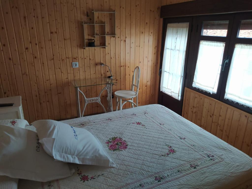 Postel nebo postele na pokoji v ubytování Casa Rural Abuela Maxi