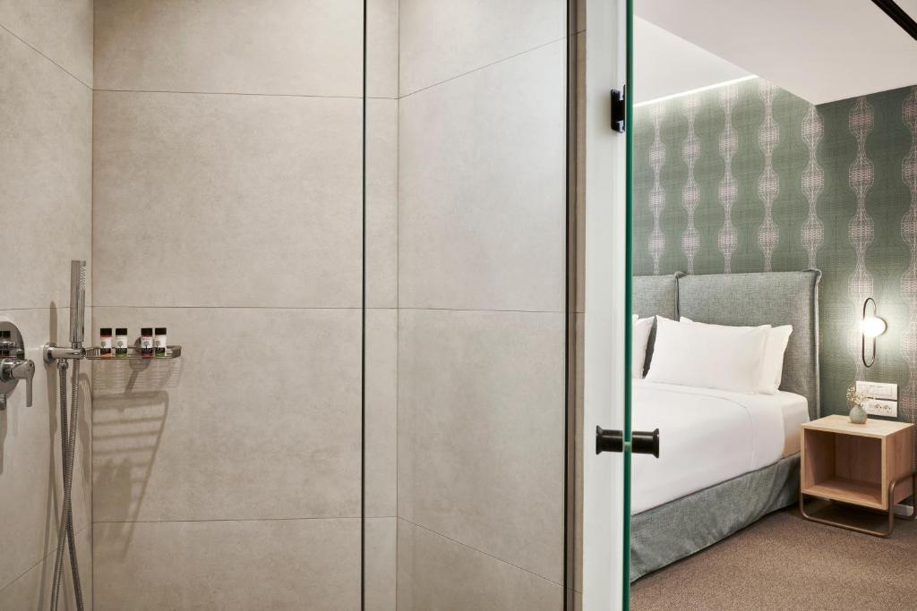 Posteľ alebo postele v izbe v ubytovaní NLH MONASTIRAKI - Neighborhood Lifestyle Hotels