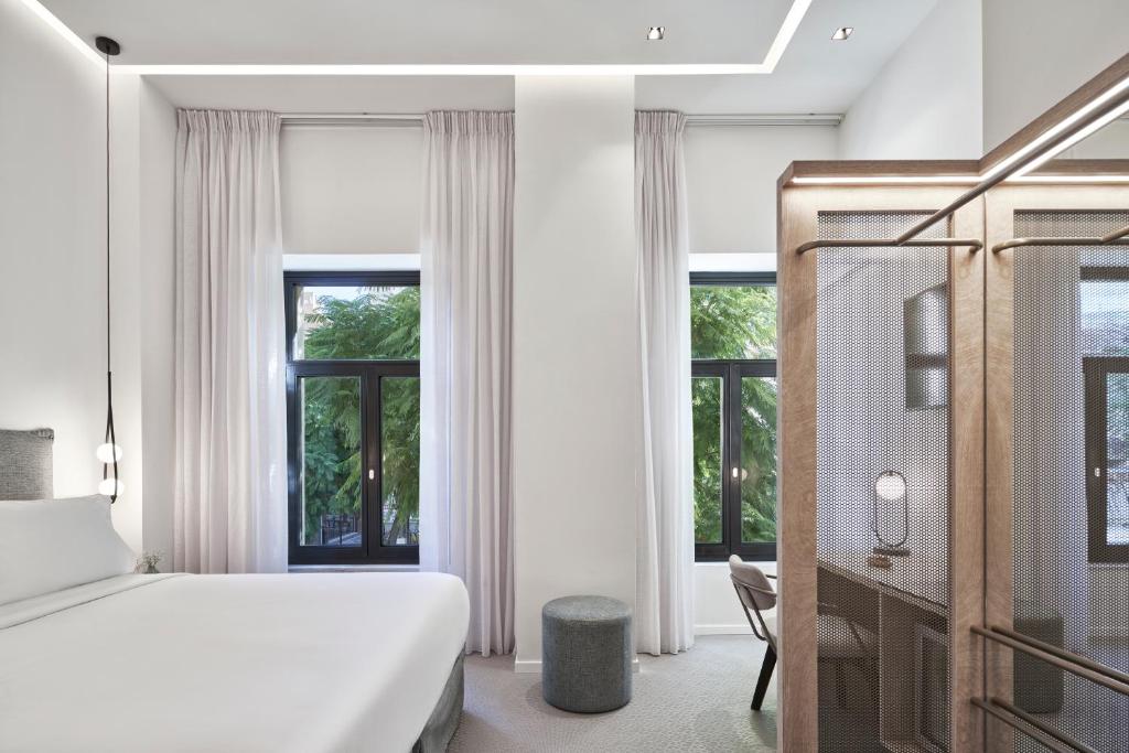 Posteľ alebo postele v izbe v ubytovaní NLH MONASTIRAKI - Neighborhood Lifestyle Hotels