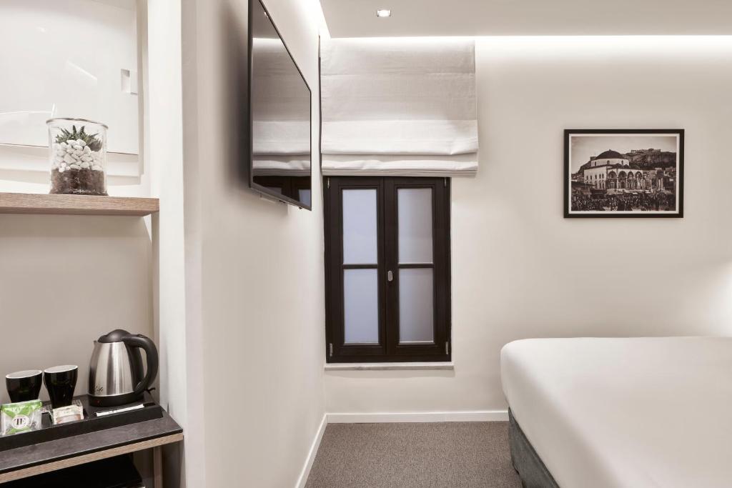 Posteľ alebo postele v izbe v ubytovaní NLH MONASTIRAKI - Neighborhood Lifestyle Hotels