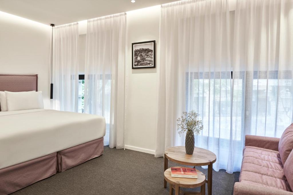 Posteľ alebo postele v izbe v ubytovaní NLH MONASTIRAKI - Neighborhood Lifestyle Hotels