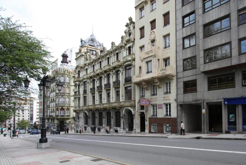 a street with tall buildings on a city street at Santacruz in Oviedo
