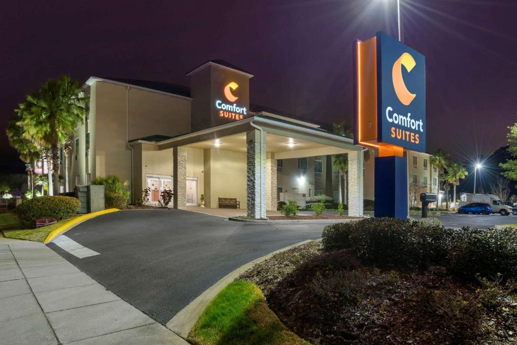 a building with a sign for a car dealership at Comfort Suites Niceville Near Eglin Air Force Base in Niceville