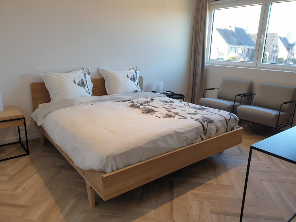 Postel nebo postele na pokoji v ubytování Snooze