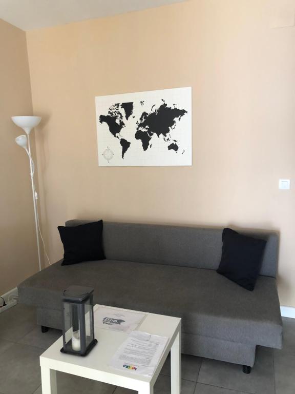 a living room with a couch and a table at Damas 3 in Cáceres