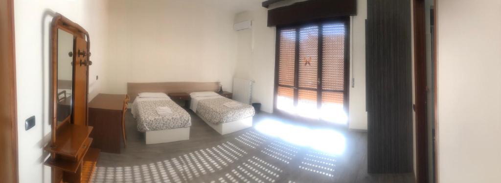Postel nebo postele na pokoji v ubytování NEW FAMILY INN
