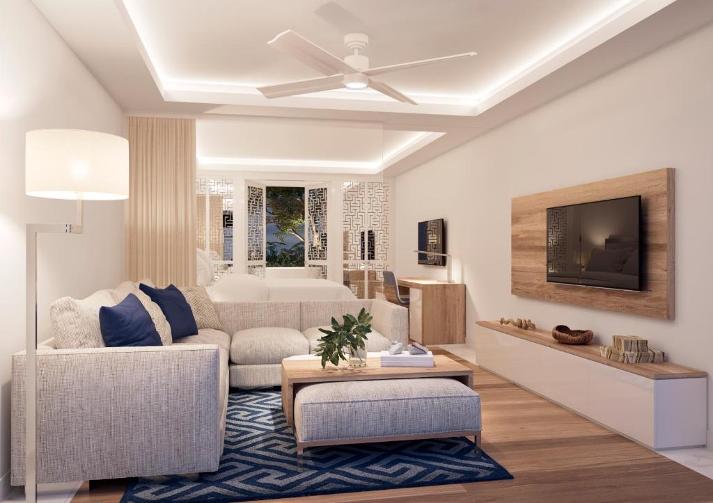 Televízia a/alebo spoločenská miestnosť v ubytovaní Minos Imperial Luxury Beach Resort & Spa Milatos