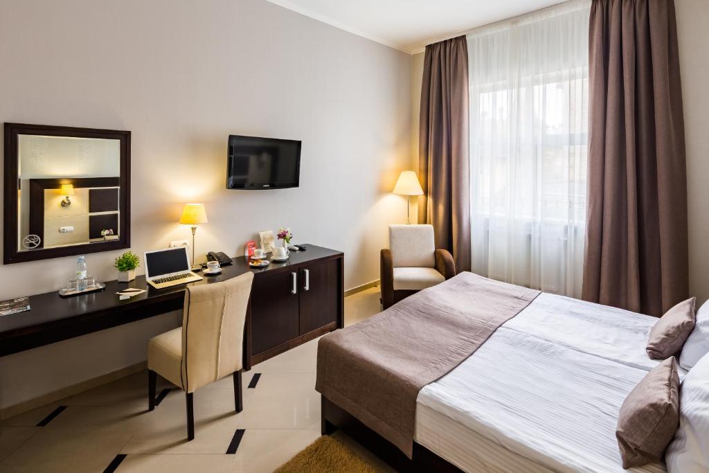 Ліжко або ліжка в номері Taurus Hotel & SPA