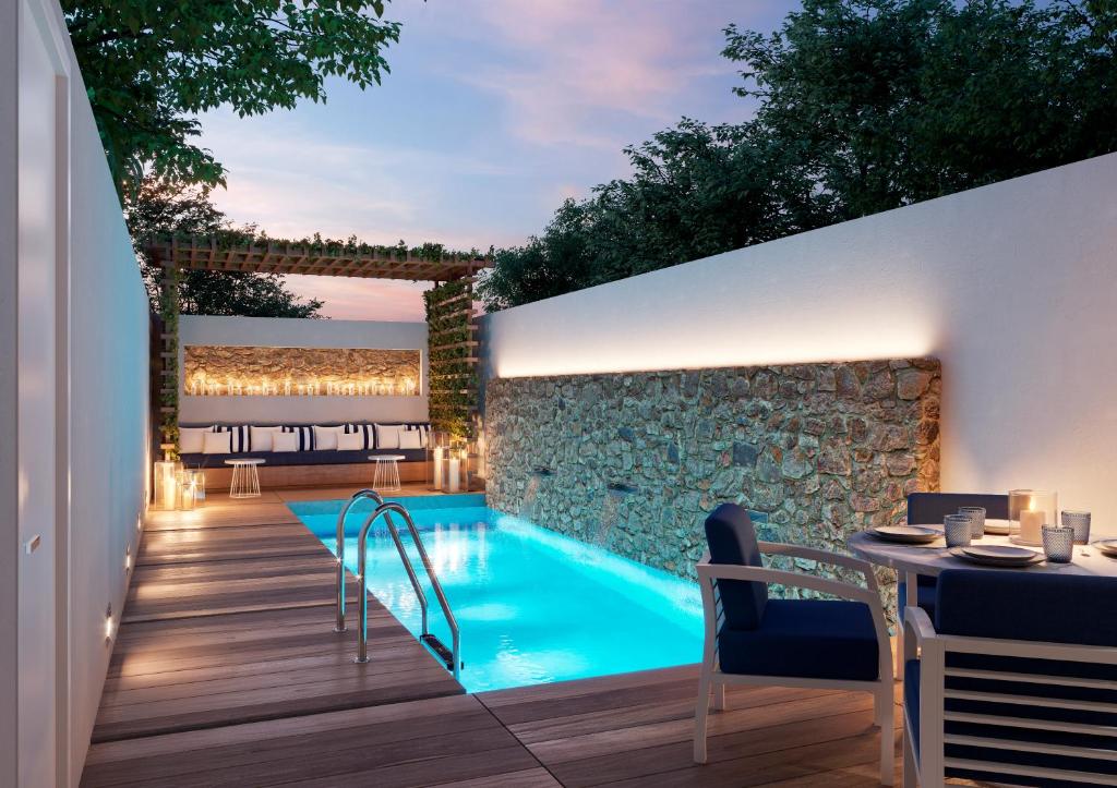 Bazén v ubytovaní Minos Imperial Luxury Beach Resort & Spa Milatos alebo v jeho blízkosti