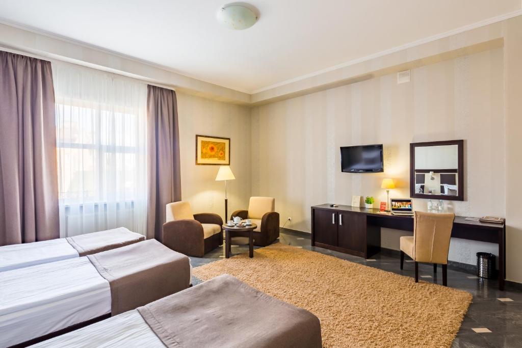 Ліжко або ліжка в номері Taurus Hotel & SPA