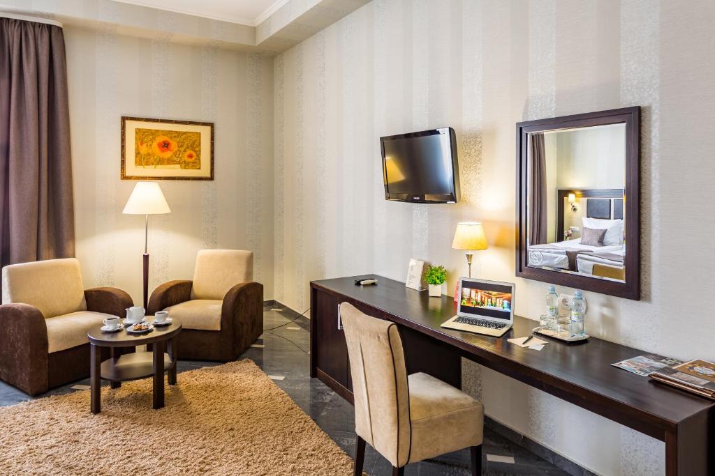 Телевізор і / або розважальний центр в Taurus Hotel & SPA
