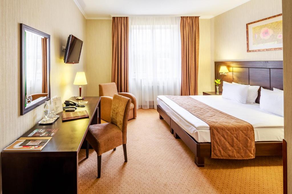 Ліжко або ліжка в номері Taurus Hotel & SPA