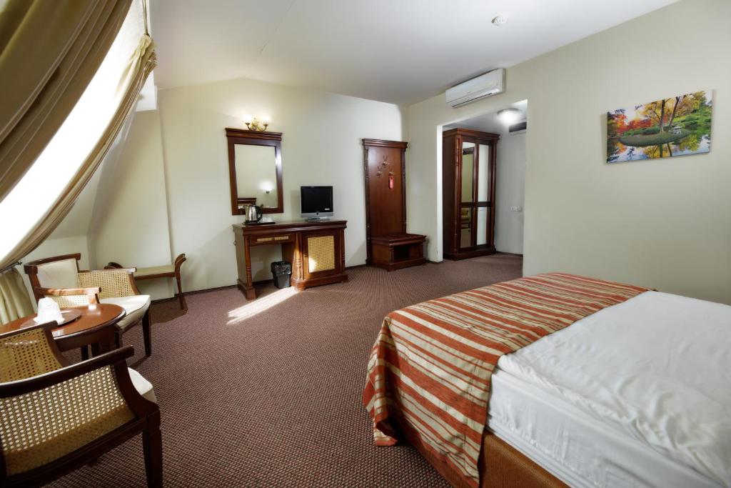 Postel nebo postele na pokoji v ubytování Atrium Hotel Ateneu City Center