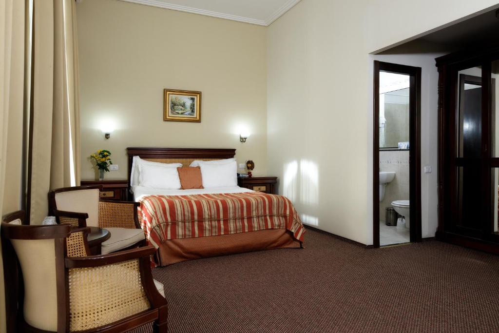 Postel nebo postele na pokoji v ubytování Atrium Hotel Ateneu City Center