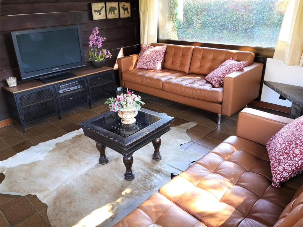 Posedenie v ubytovaní Chalet con gran jardín en Llivia