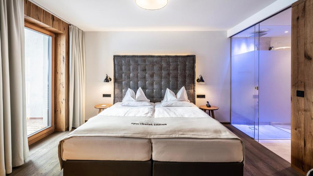 Posteľ alebo postele v izbe v ubytovaní Dolomiten Residenz - Sporthotel Sillian