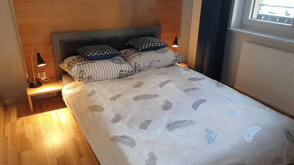 Posteľ alebo postele v izbe v ubytovaní LAGUNA Apartament 7 Willa Maria
