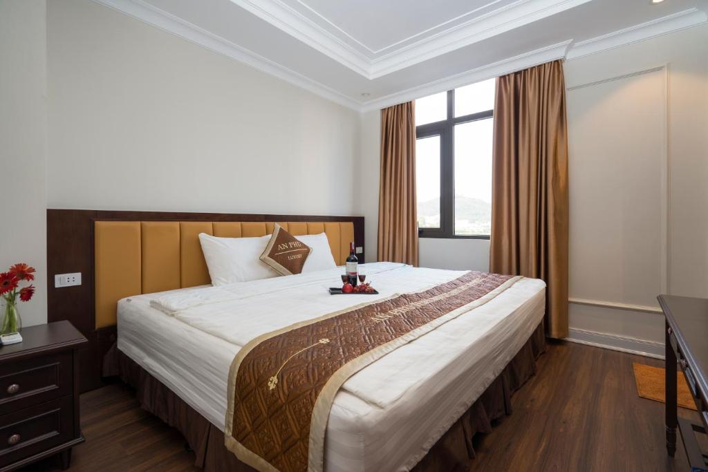 Postel nebo postele na pokoji v ubytování An Phú Nguyễn Hoàng Hotel