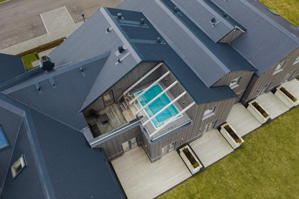 an overhead view of a house with a swimming pool at Hotel Berg by Keflavik Airport in Keflavík