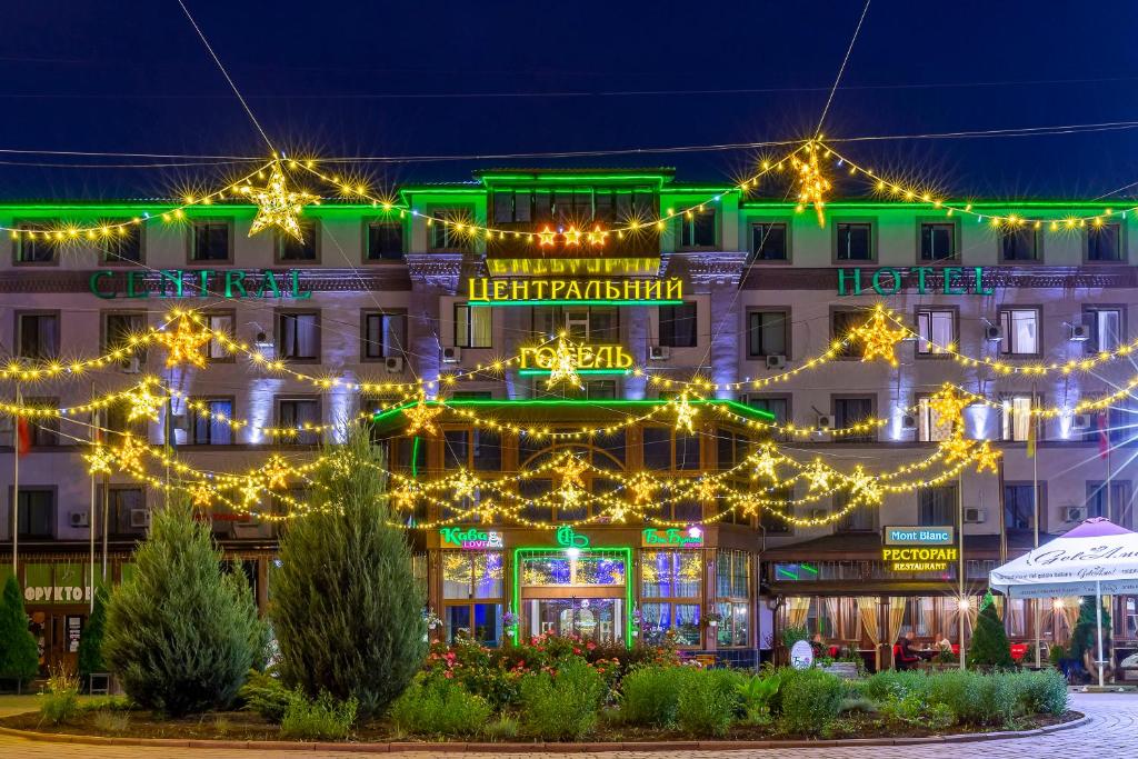 a building with christmas lights in front of it at Centralny Hotel in Kryvyi Rih