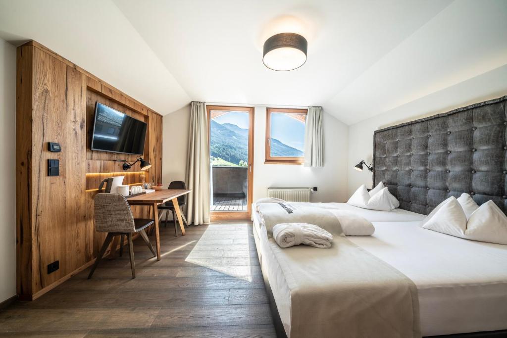 Posteľ alebo postele v izbe v ubytovaní Dolomiten Residenz - Sporthotel Sillian
