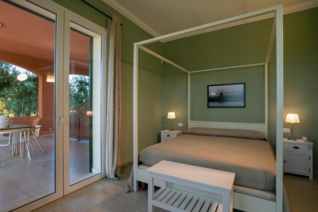 Postel nebo postele na pokoji v ubytování Corte Olea Resort
