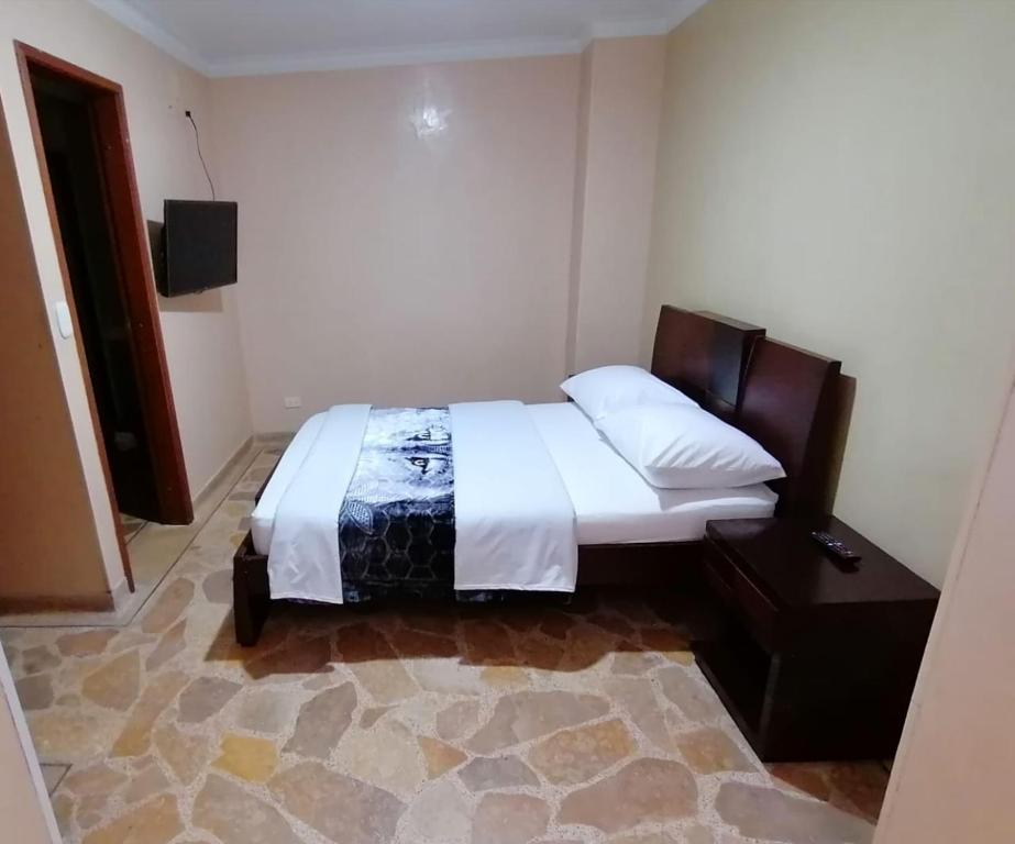 Postel nebo postele na pokoji v ubytování HOTEL GOLDEN SUITE