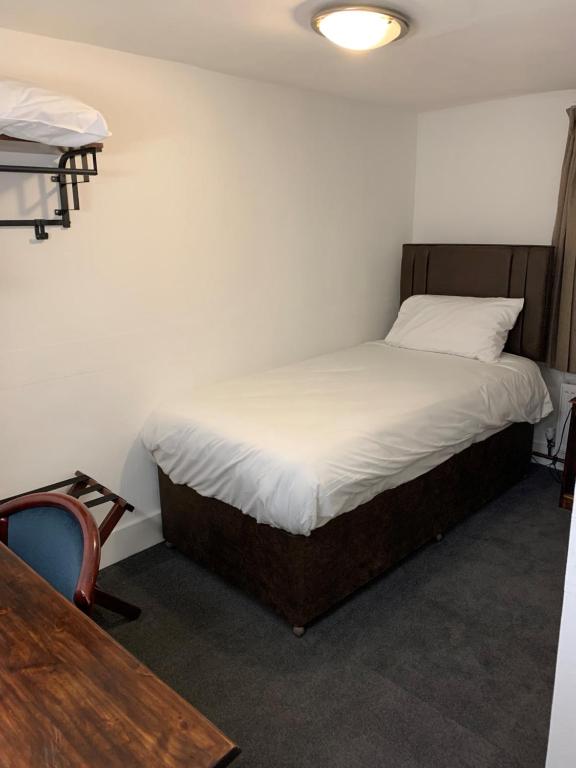 Postel nebo postele na pokoji v ubytování Castle Hotel