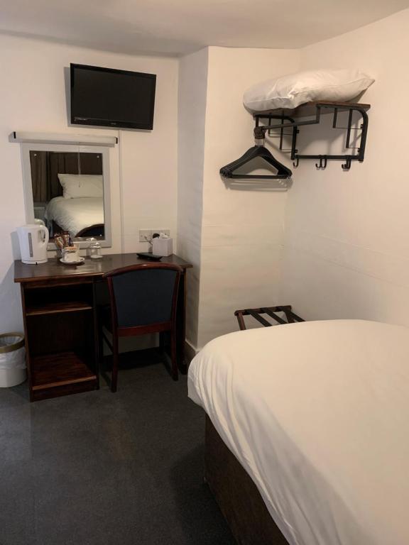 Postel nebo postele na pokoji v ubytování Castle Hotel