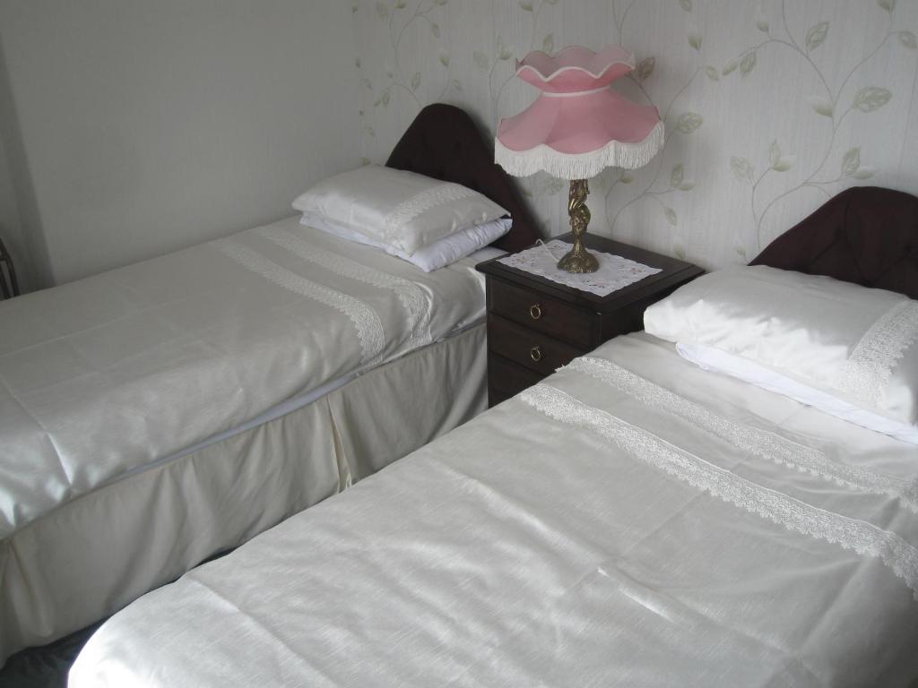 Postel nebo postele na pokoji v ubytování Bron Orme Private Hotel