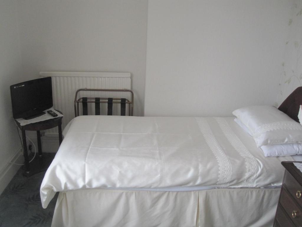Postel nebo postele na pokoji v ubytování Bron Orme Private Hotel